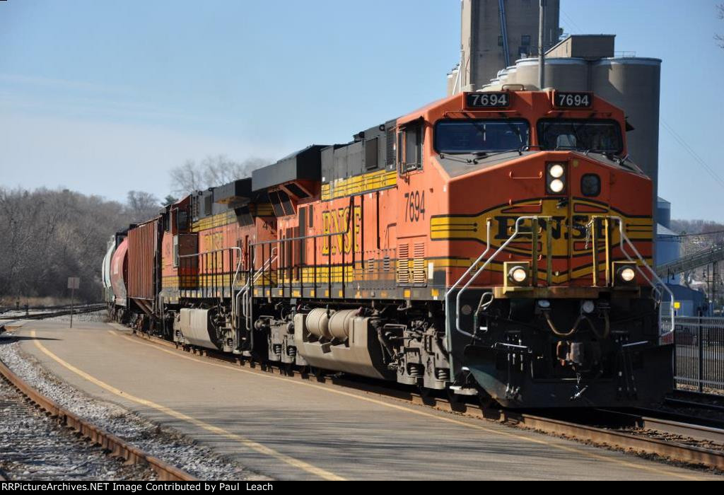 Grain train rolls east through the station